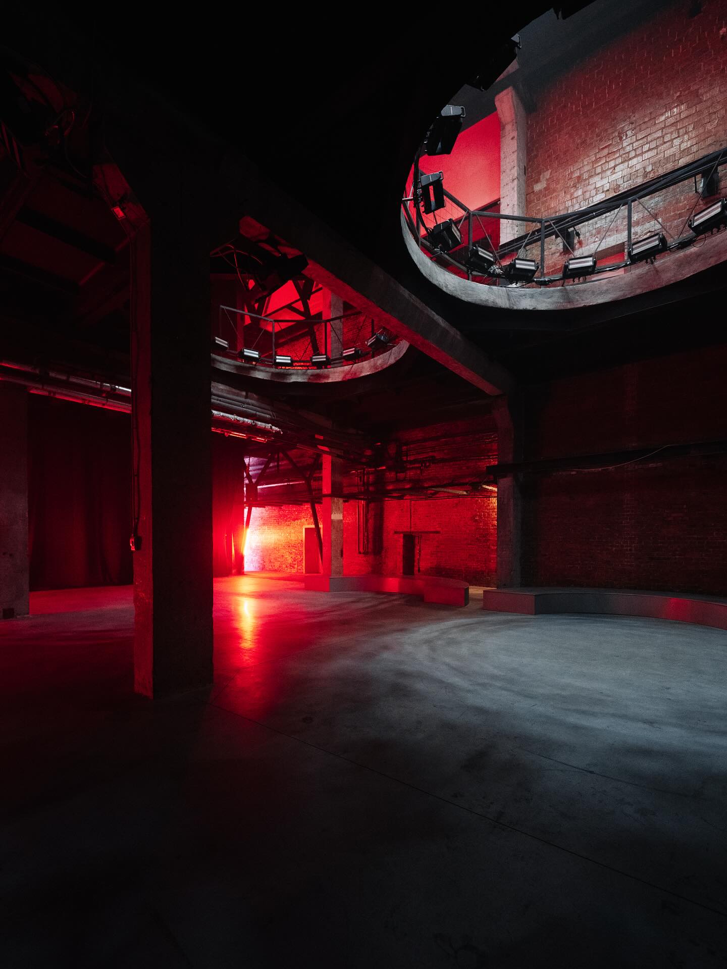 Red-lit interior of Community Berlin